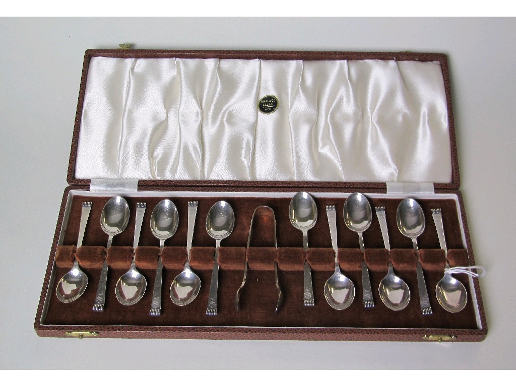 Appraisal: Cased set of twelve silver spoons with tongs Sheffield