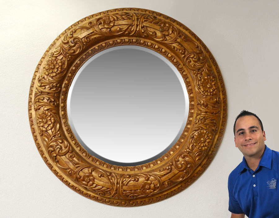 Appraisal: DRAMATICALLY OVERSIZED ROUND GOLD GILT MIRROR Carved floral motif and