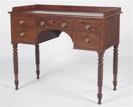 Appraisal: A Regency mahogany kneehole side table the three quarter gallery