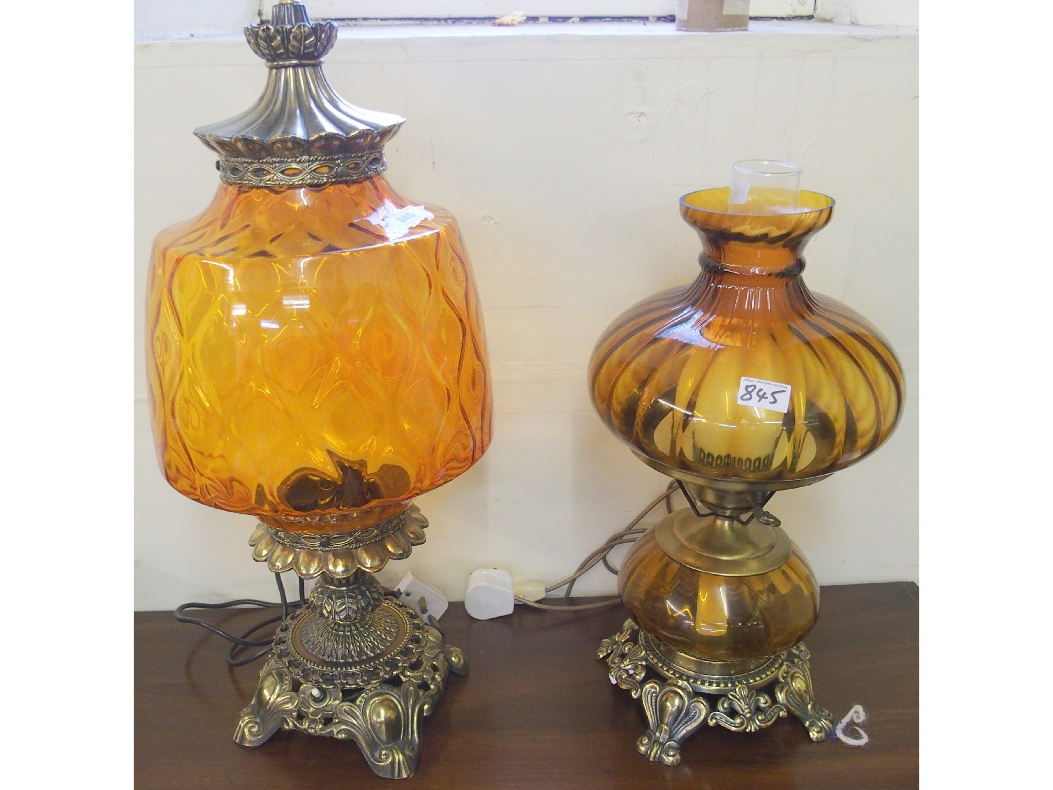 Appraisal: Two amber coloured glass table lamps