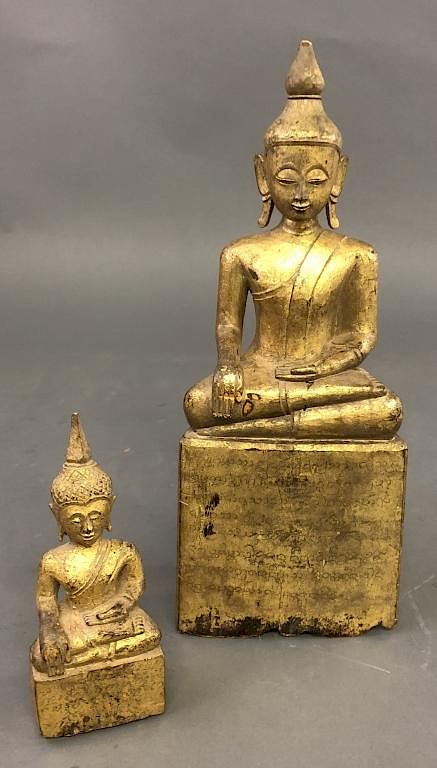 Appraisal: Two Gilt Wood Carved Buddhas Two gilt wood carved Buddhas