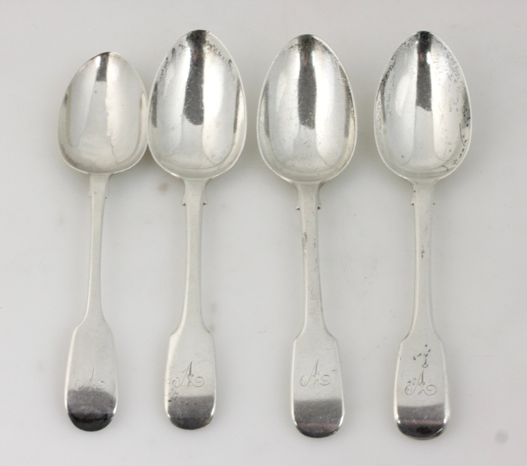 Appraisal: Four Victorian fiddle pattern silver dessert spoons London hallmarks various