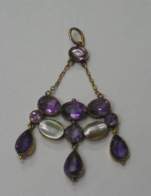 Appraisal: AN AMETHYST AND MOTHER OF PEARL PENDANT having seven round