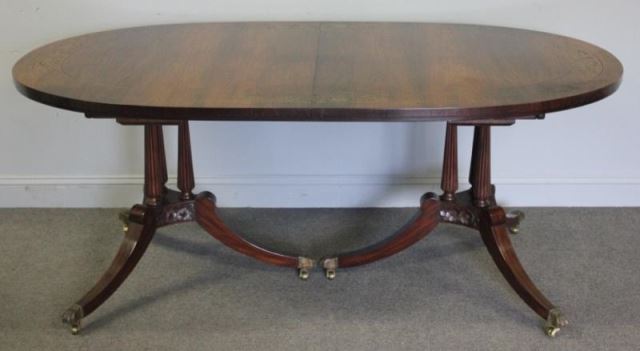 Appraisal: Rosewood and Brass Inlaid Oval Dining TableRaised on Twin Pedestals