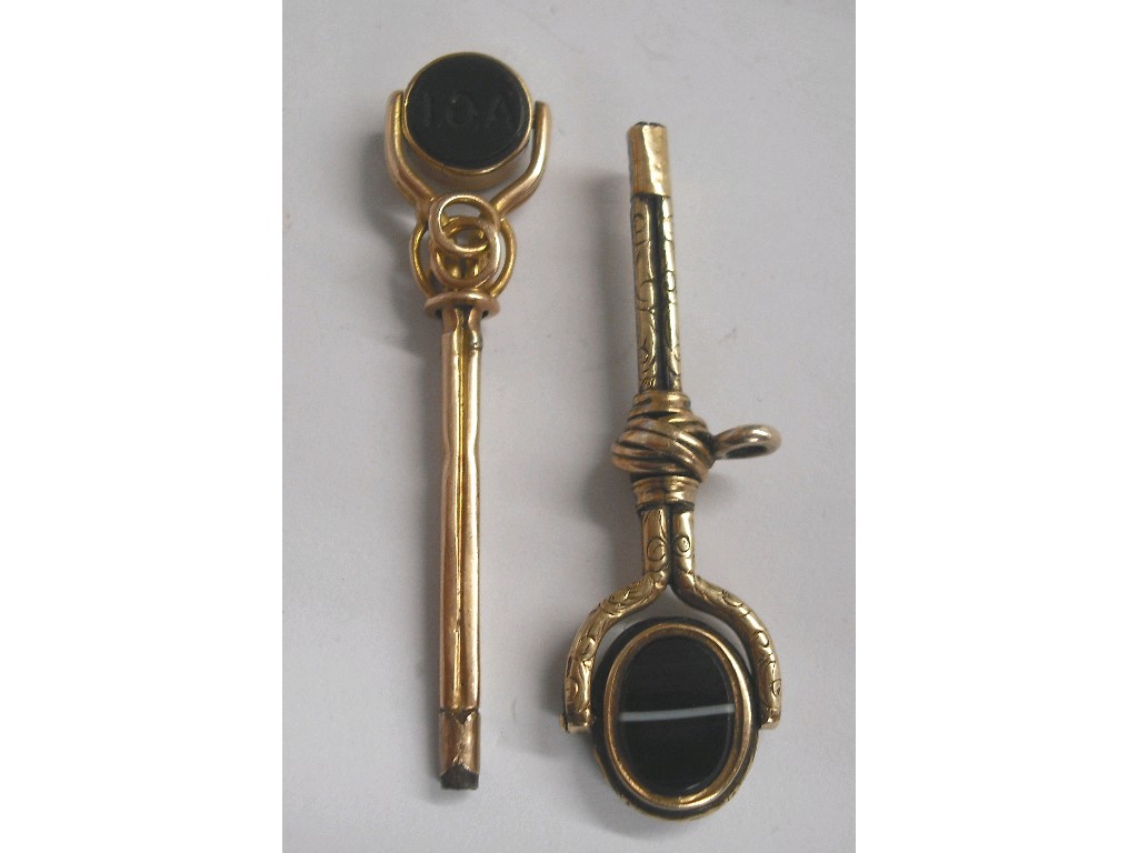 Appraisal: Two similar long gilt gold pocket watch keys each with