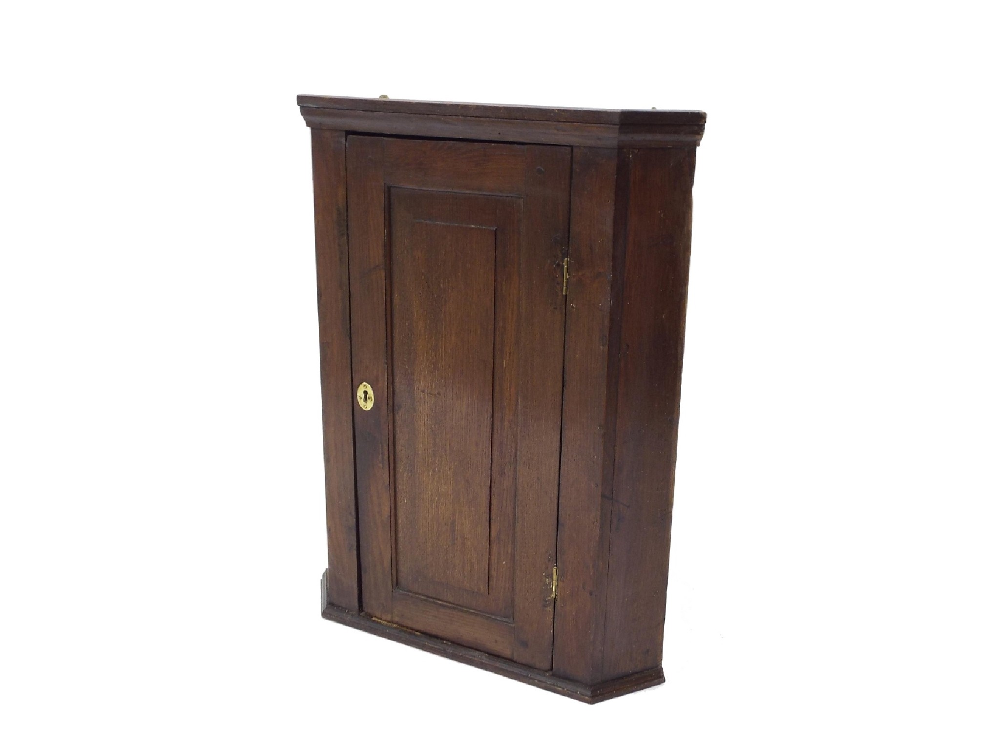 Appraisal: Georgian oak hanging corner cupboard with single panel door enclosing