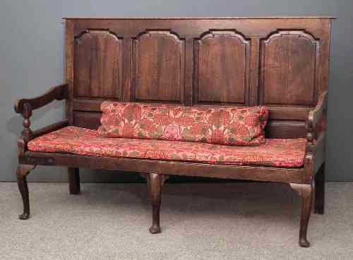 Appraisal: An th Century oak settle the back with four arched