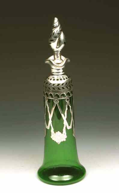 Appraisal: A GREEN GLASS AND SILVER OVERLAY DECANTER with pierced leaf