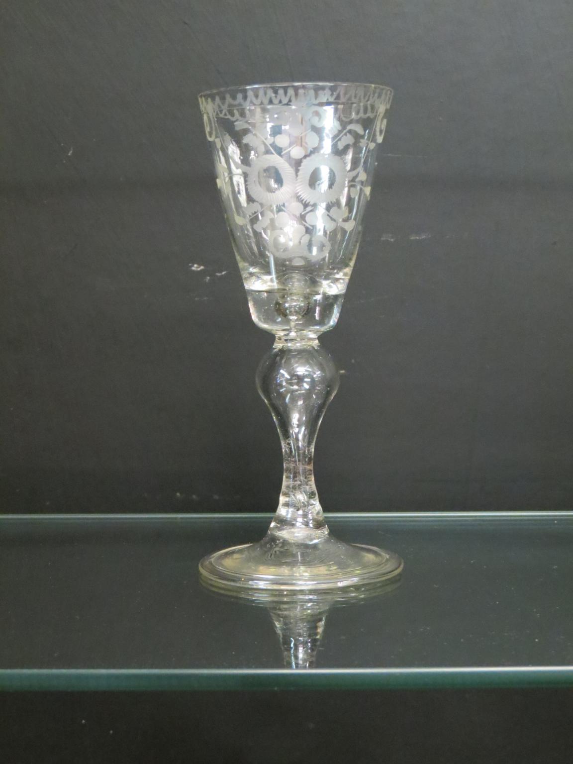 Appraisal: An th century continental wine glass engraved round funnel bowl