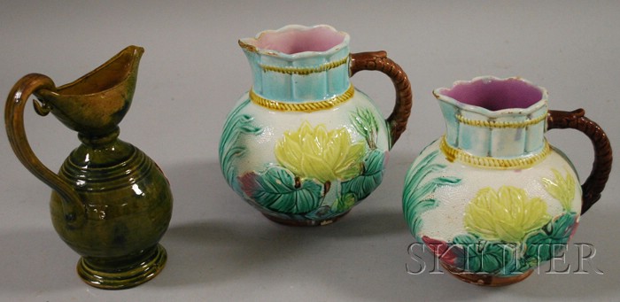 Appraisal: Pair of Majolica Water Lily Decorated Jugs and a Glazed