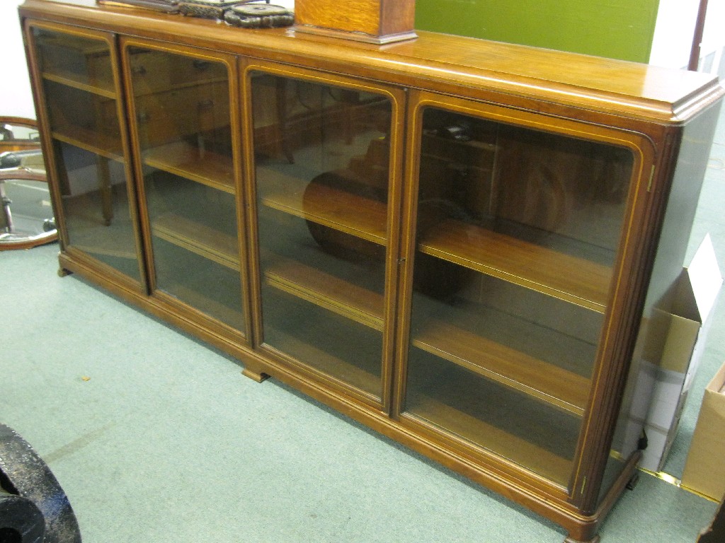 Appraisal: Victorian mahogany four door glazed bookcase with string inlay