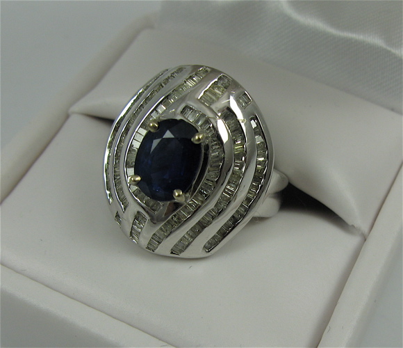 Appraisal: SAPPHIRE DIAMOND AND K WHITE GOLD RING with appraisal Centering