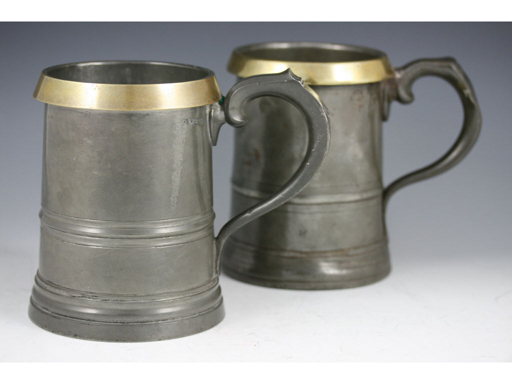 Appraisal: Two English Pewter Stout Mugs quart size mid th c