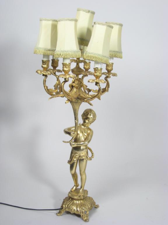 Appraisal: A modern gilt-metal five branch Candelabrum with figural support ft