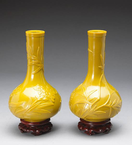 Appraisal: A pair of 'mustard' yellow Peking glass bottle vases th