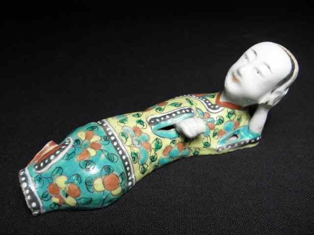 Appraisal: Chinese porcelain figure of a reclining woman Famille rose painted