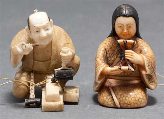 Appraisal: Two Japanese carved ivory netsukes kneeling carpenter and a seated