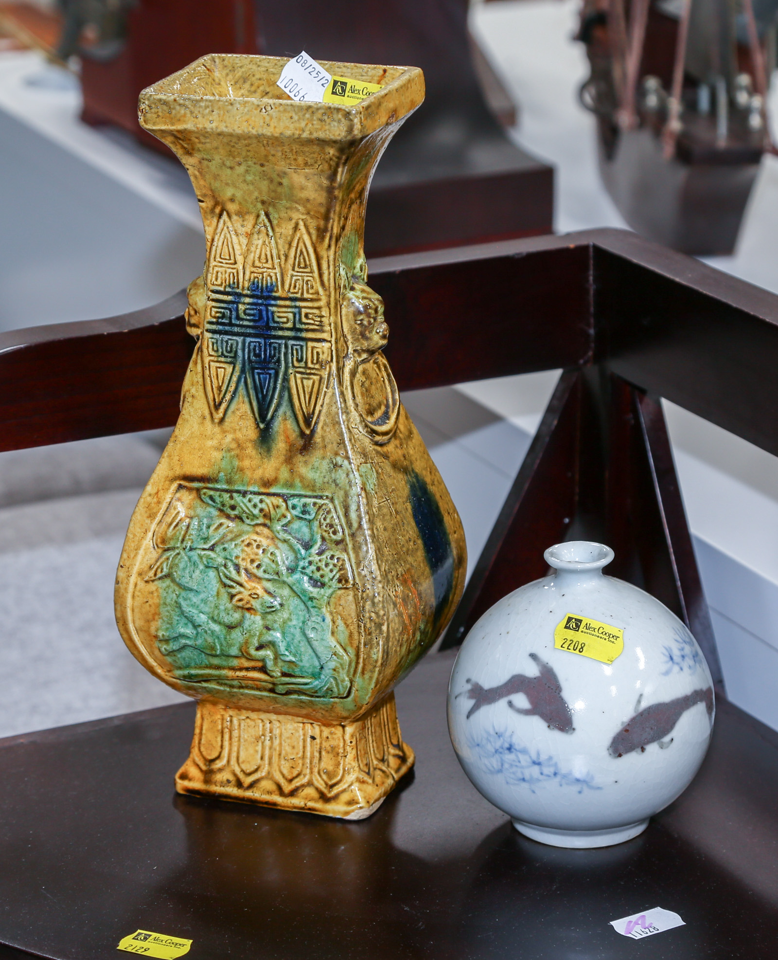 Appraisal: TWO ASIAN CERAMIC VASES Comprising a Chinese Tang style splash-glazed