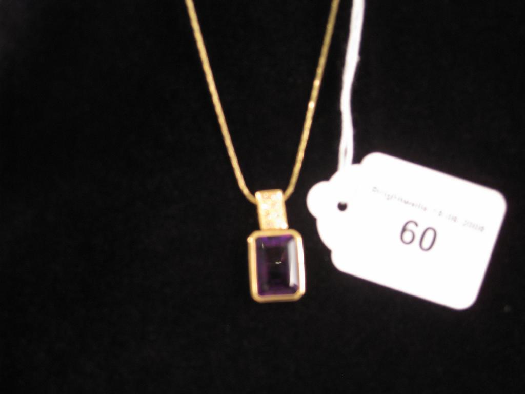 Appraisal: A Contemporary Amethyst and Diamond Pendant the step-cut amethyst collet-set