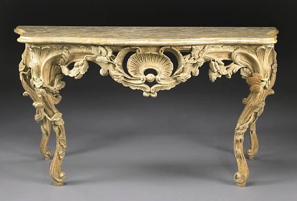 Appraisal: An Italian Rococo style oak console table The serpentine variegated