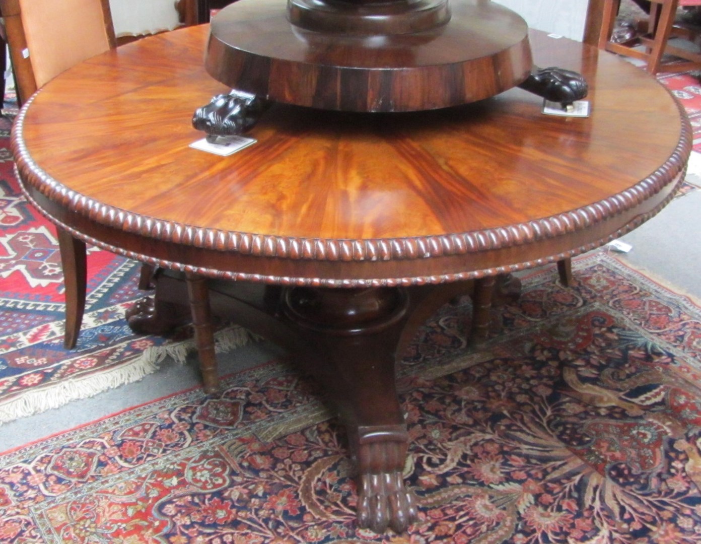 Appraisal: A th century mahogany breakfast table the segmented veneered circular