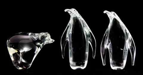 Appraisal: TWO STEUBEN GLASS PENGUINS and a Swedish glass polar bear