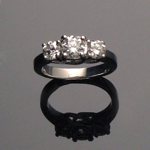 Appraisal: A three stone diamond and k white gold ring estimated