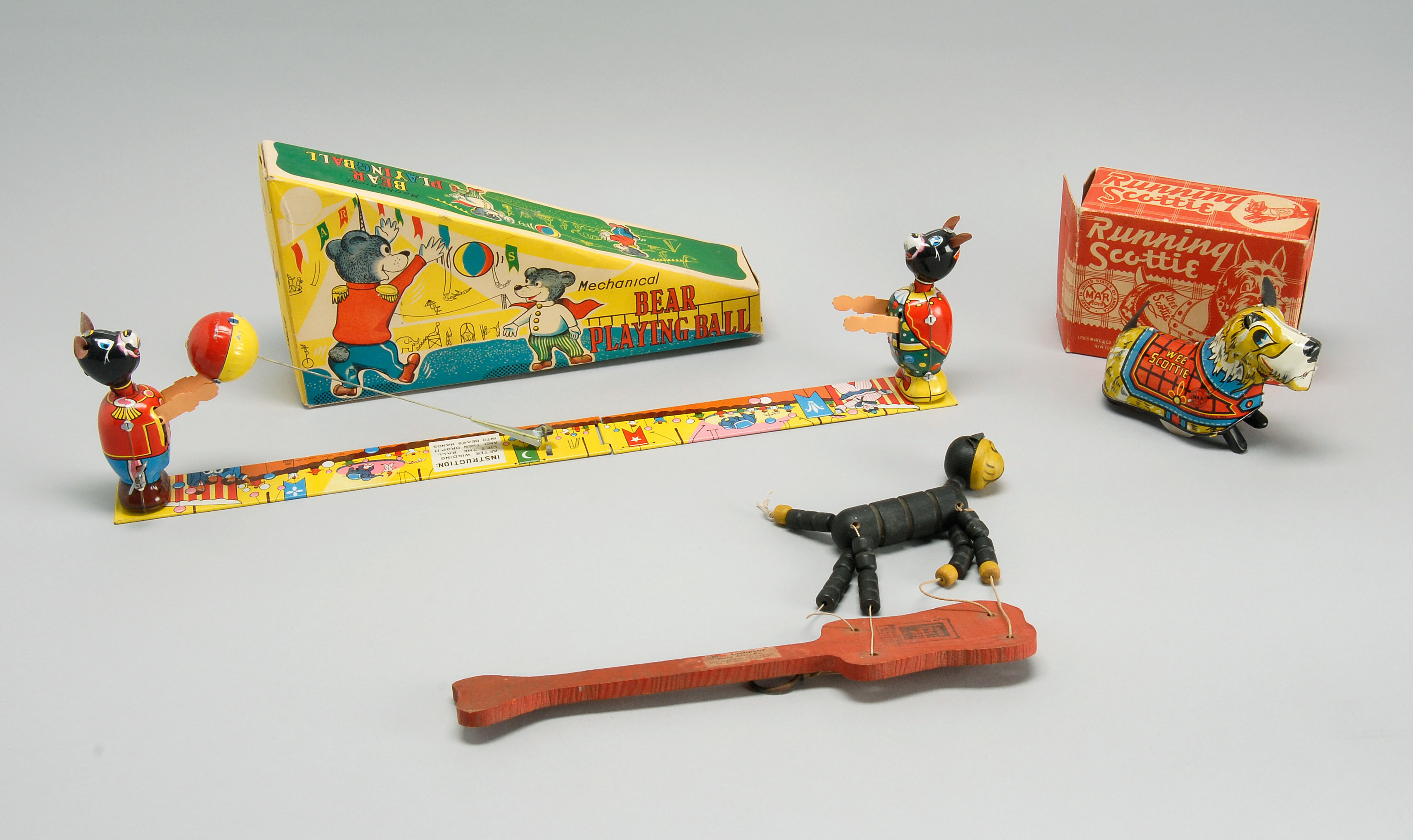 Appraisal: TWO BOXED TIN LITHOGRAPHED TOYS Together with a Felix the