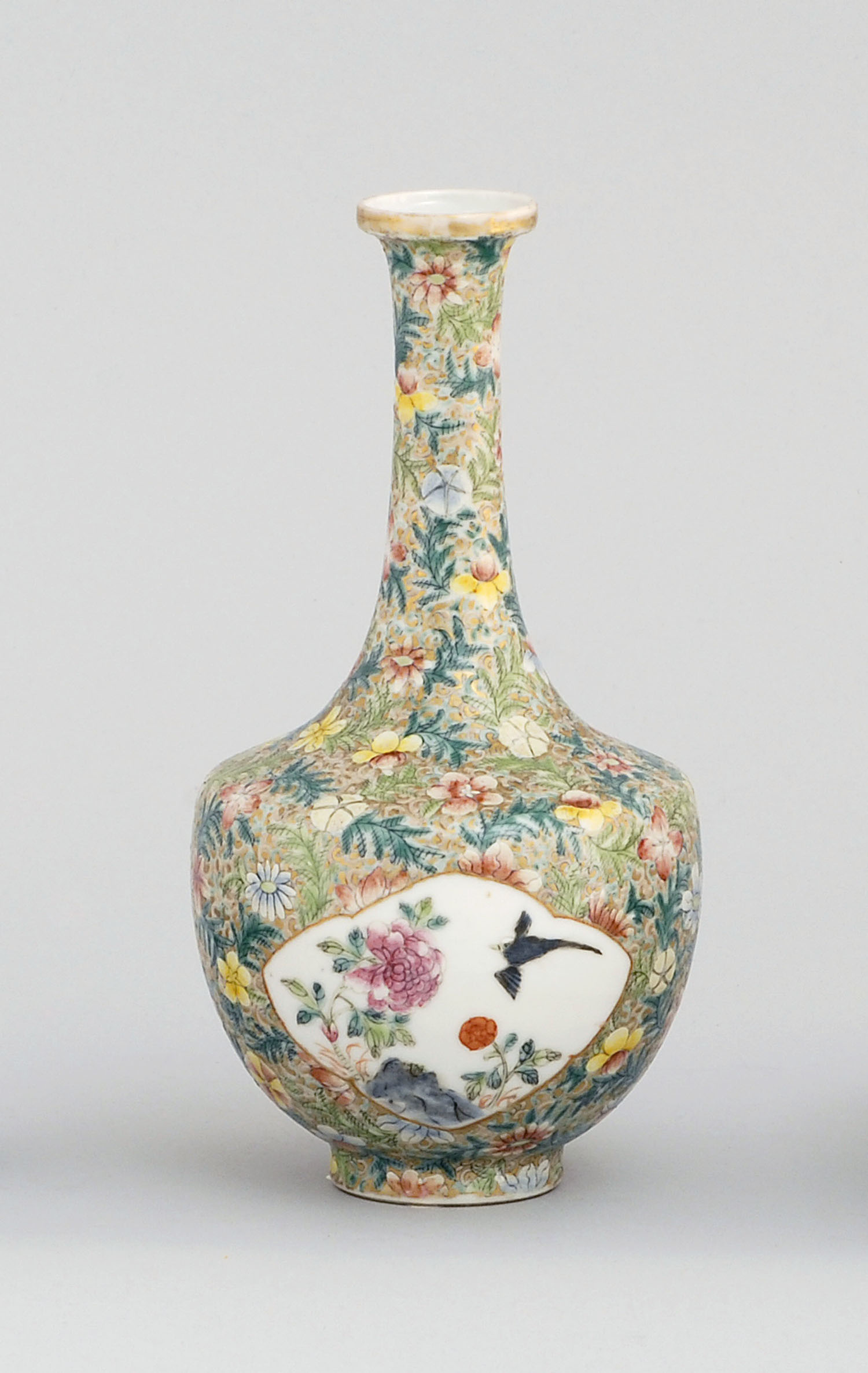 Appraisal: POLYCHROME PORCELAIN VASE th CenturyIn mallet form with bird and