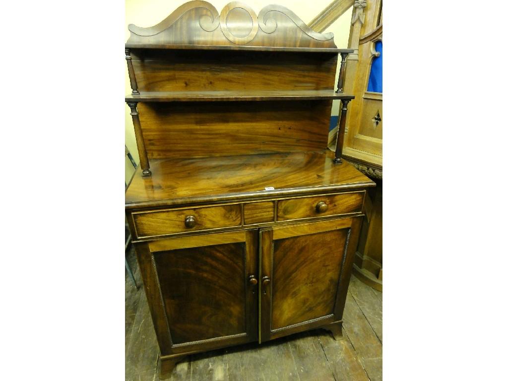 Appraisal: An early th century mahogany chiffonier the raised panelled back