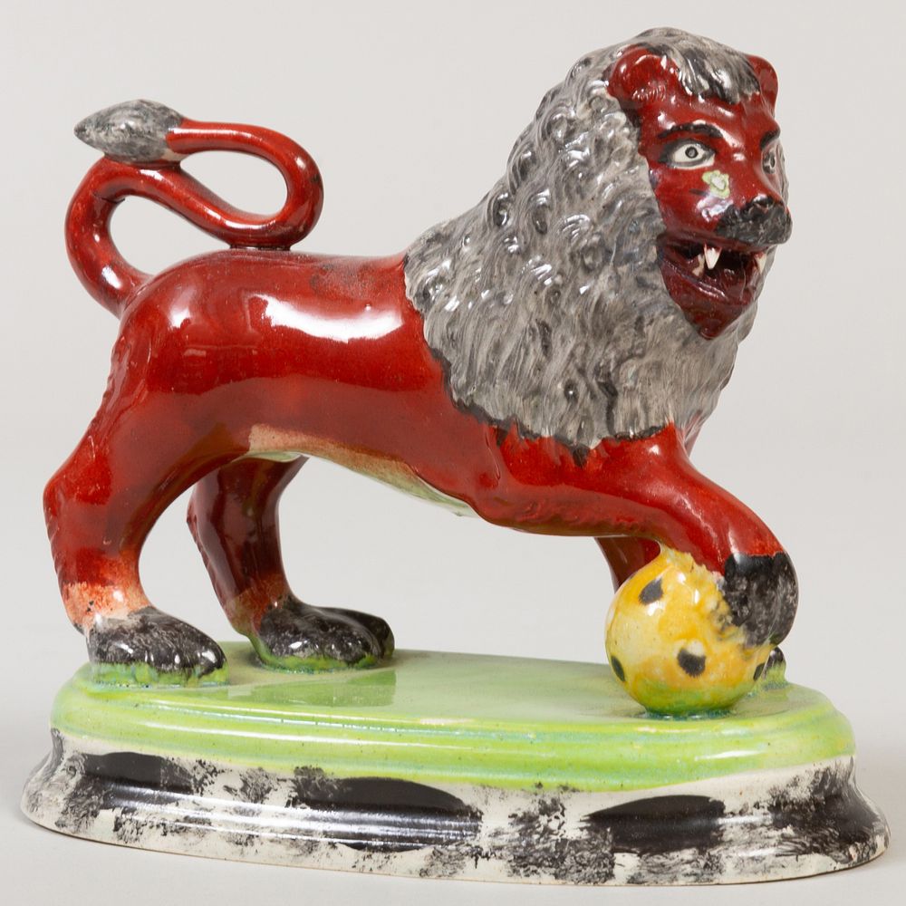 Appraisal: Staffordshire Pottery Model of a Red Lion in high Literature