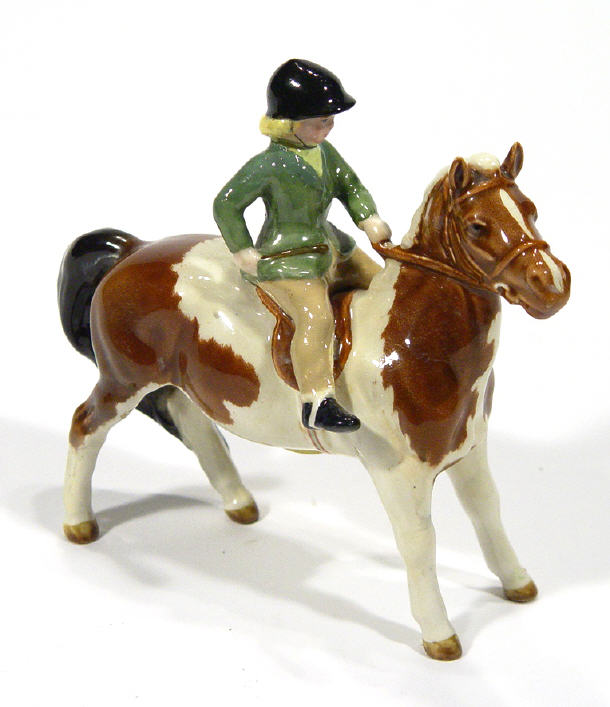 Appraisal: Hand painted Beswick girl on a brown and white pony