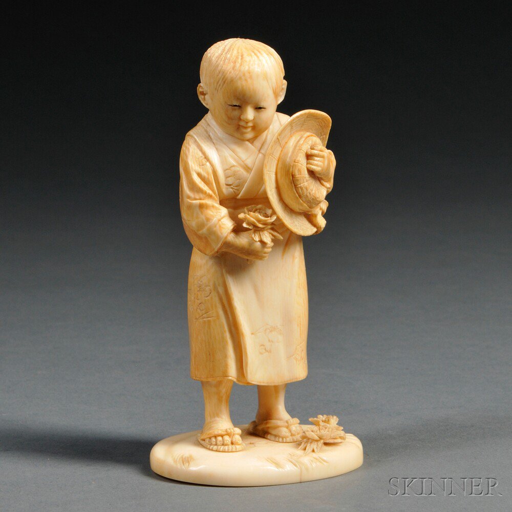 Appraisal: Ivory Okimono of a Boy Japan th century depicted carrying