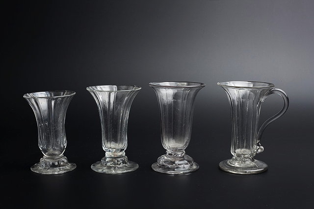 Appraisal: A GEORGE III JELLY GLASS of flared panelled form with