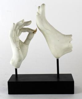 Appraisal: Sculpture of hand tickling foot Sculpture in plaster of hand