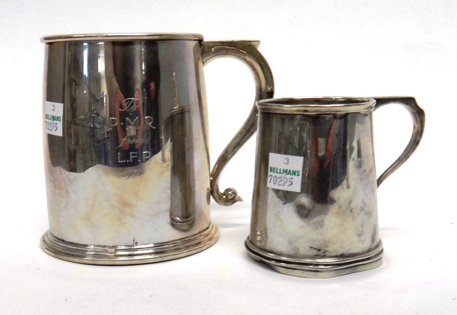 Appraisal: A silver mug of tapering form with an angular handle