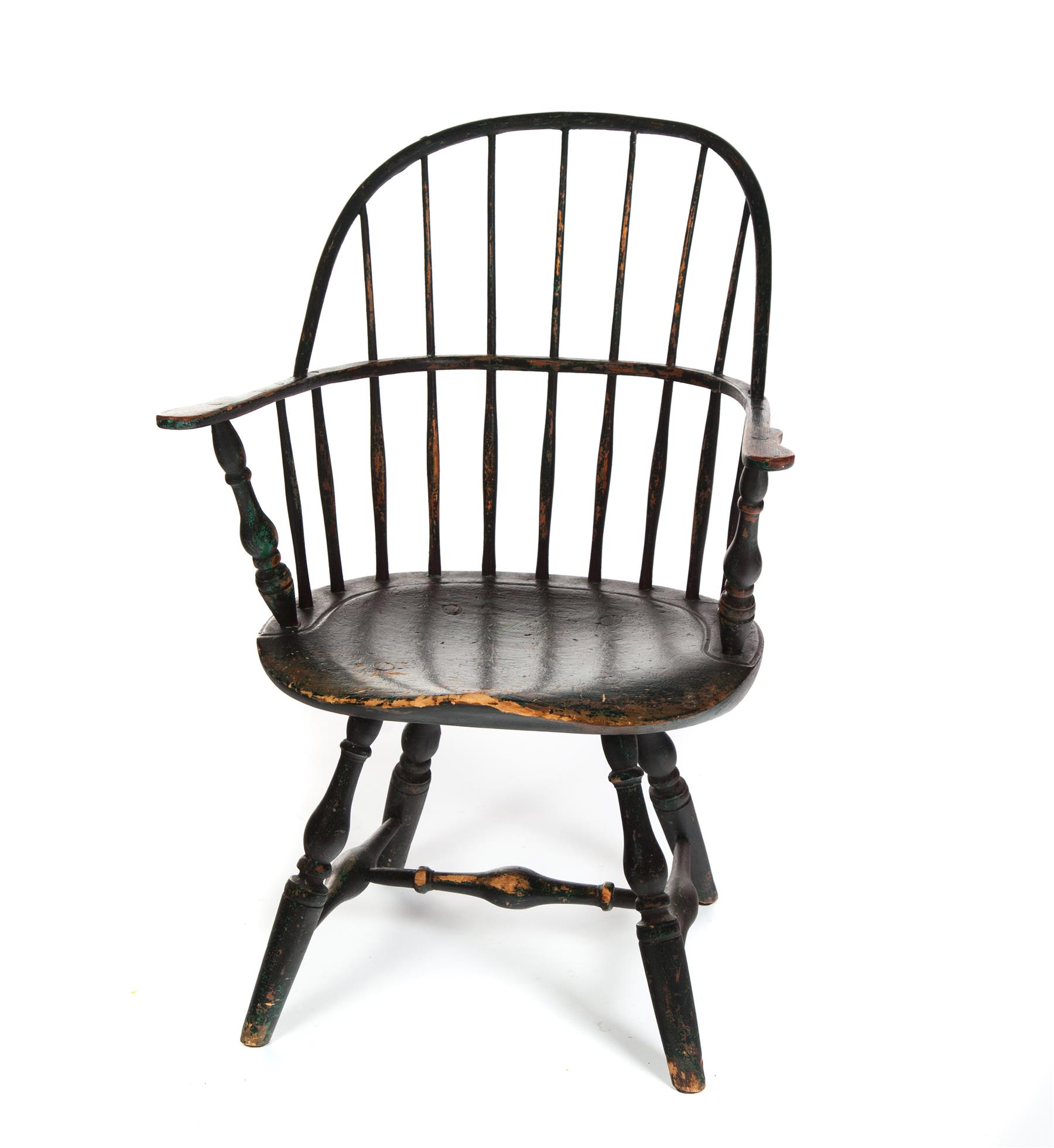 Appraisal: AMERICAN WINDSOR SACKBACK ARMCHAIR Nineteenth century Shaped arms turned legs