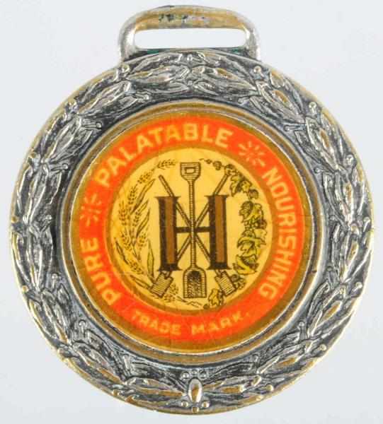 Appraisal: John Hauenstein Brewing Co Enameled Fob From Embossed th Anniversary