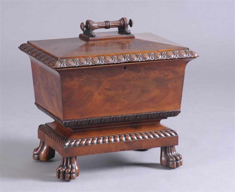 Appraisal: VICTORIAN CARVED MAHOGANY CELLARETTE The hinged top with egg-and-dart edge