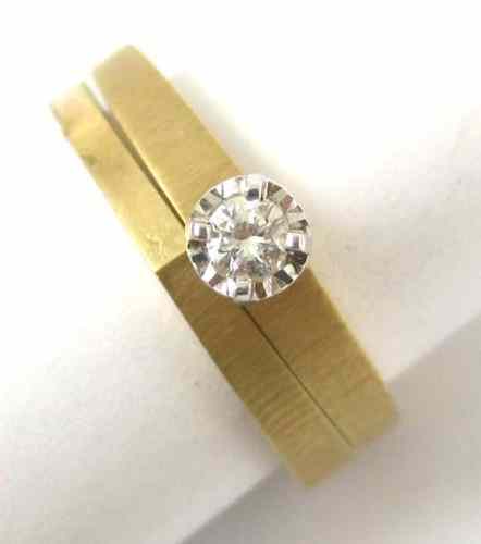 Appraisal: DIAMOND AND FOURTEEN KARAT GOLD RING SET featuring a round