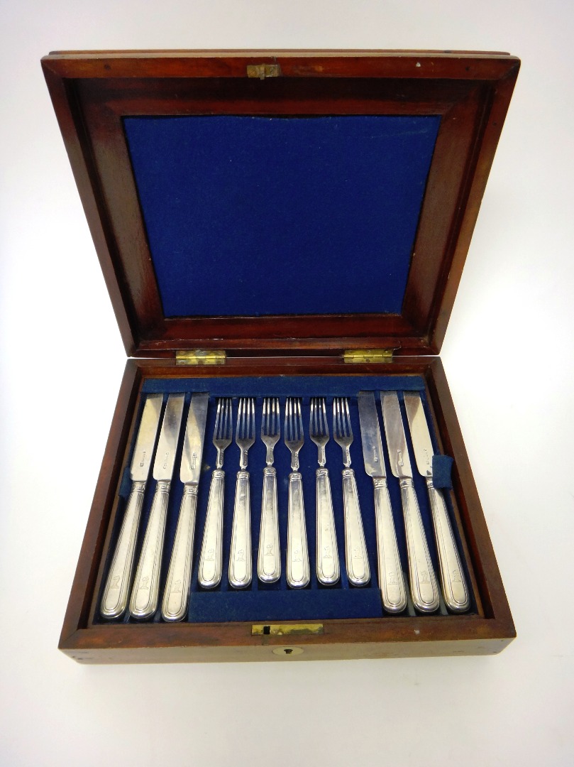 Appraisal: Twelve silver bladed dessert knives with loaded silver handles Sheffield