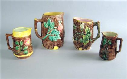 Appraisal: Four English majolica pitchers th century Comprising two with a