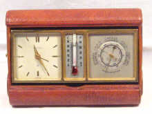 Appraisal: A leather covered combination clock barometer by Angelus circa