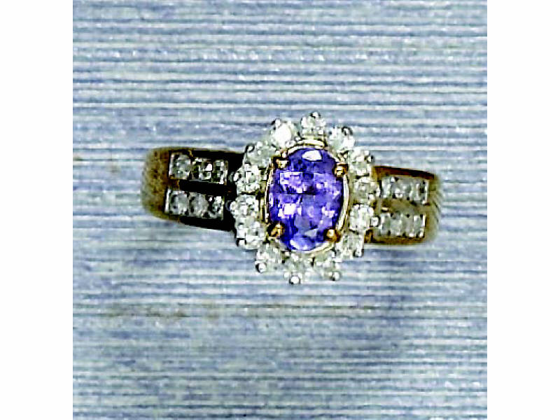 Appraisal: TANZANITE AND DIAMOND RING k yellow gold lady's ring with