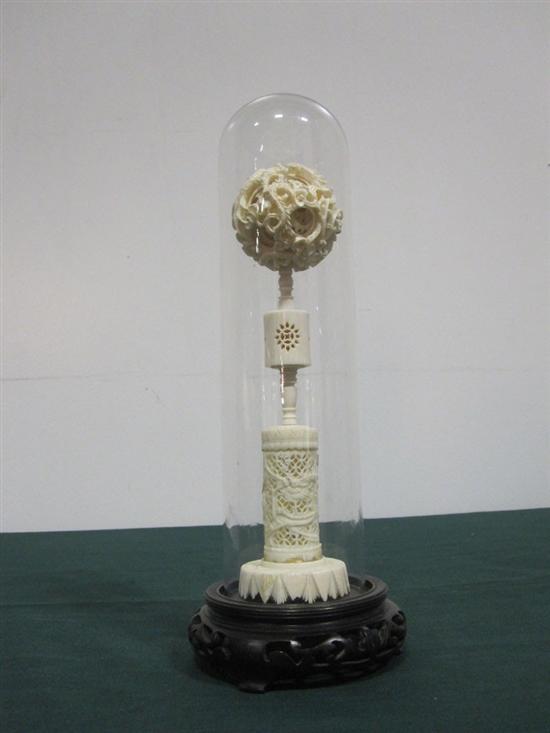 Appraisal: ORIENTAL CARVED IVORY PUZZLE BALL ON STAND With carved wood