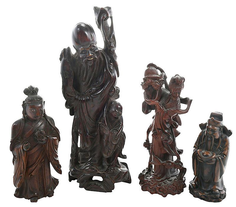 Appraisal: Four Vintage Asian Carved Figurines th th century comprising one