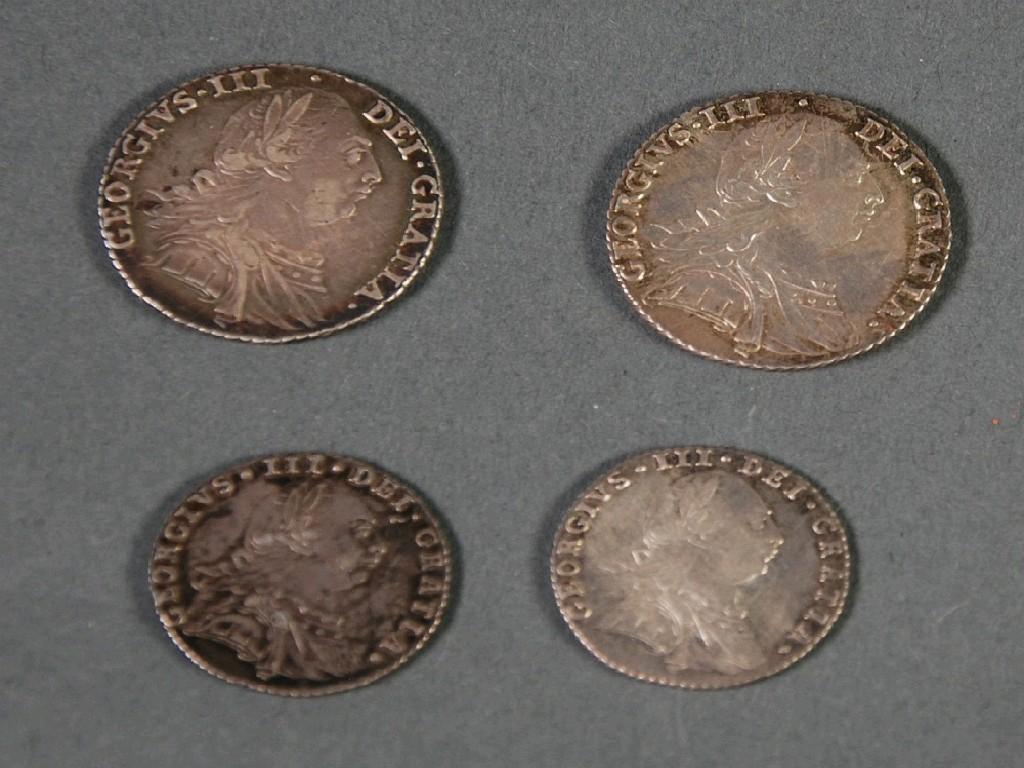 Appraisal: TWO GEORGE III SILVER SHILLINGS reverse with semee of hearts