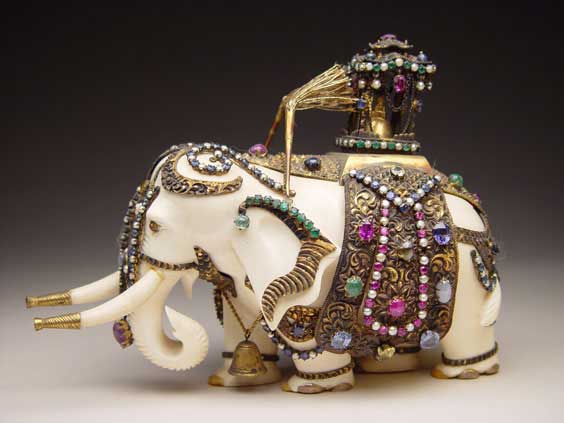 Appraisal: INDIAN JEWELED IVORY ELEPHANT Indian carved ivory caparisoned elephant covered