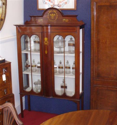 Appraisal: An Edwardian mahogany display cabinet the arched inlaid panel over