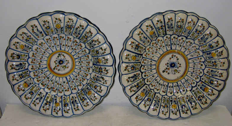 Appraisal: PAIR OF FRENCH FAYENCE DISPLAY PLATES Each lobbed painted fruit